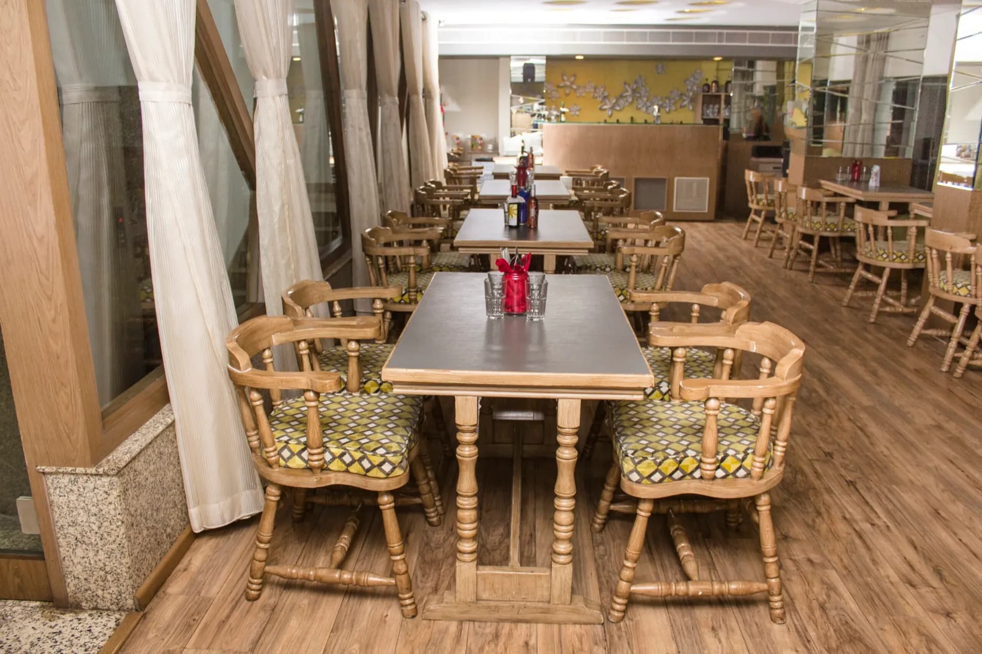 A dining table set inside Freakk De Bistro at Hotel Centre Point, Nagpur.