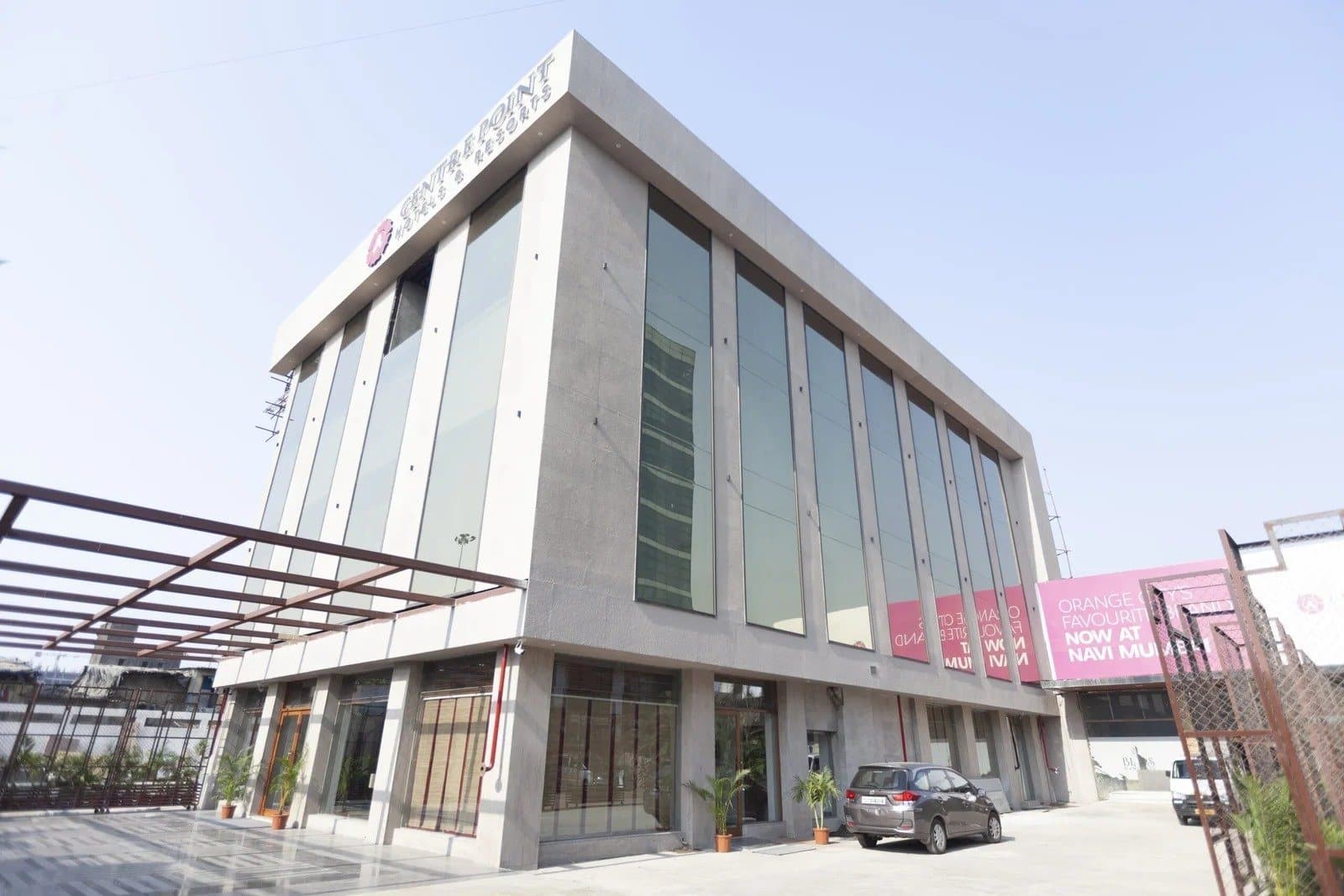 The glass-fronted building of Centre Point Navi Mumbai on the Thane–Belapur Road.